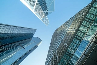 Picture looking up at multiple high rises